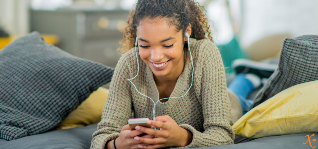 Women scrolling through phone while listening to music