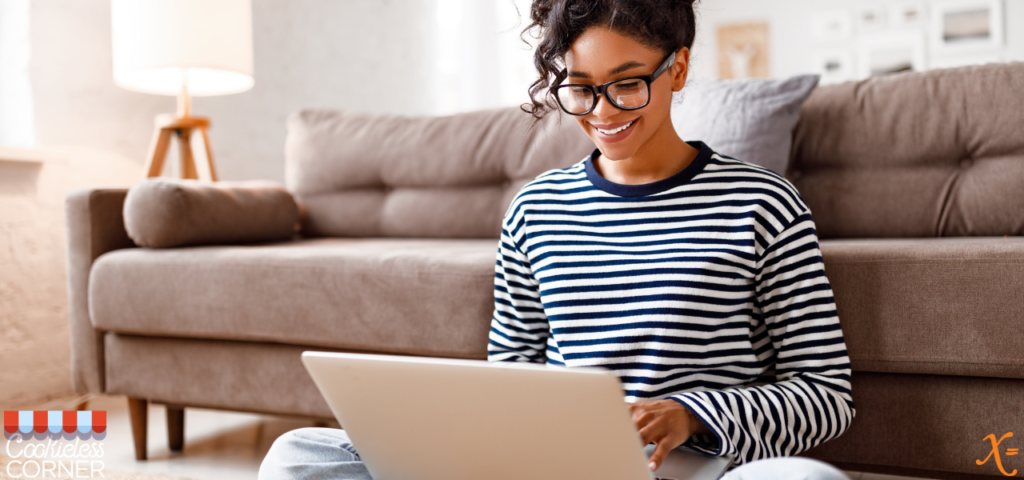 woman happily engaging with a website on her laptop