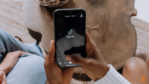 Person loading TikTok app