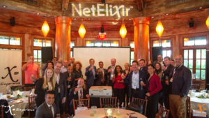group of people raising a champagne toast to the camera