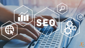 person on laptop with overlay of SEO icons